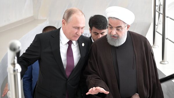  Владимир Путин и президент Ирана Хасан Роухани во время встречи в рамках саммита глав государств-участников V Каспийского саммита в Актау. 12 августа 2018