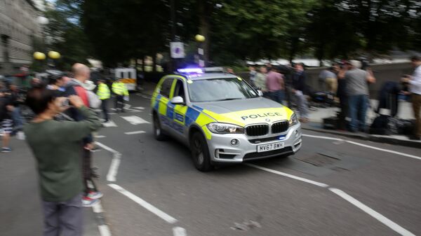 Автомобиль полиции у здания парламента в Лондоне, Великобритания. Архивное фото