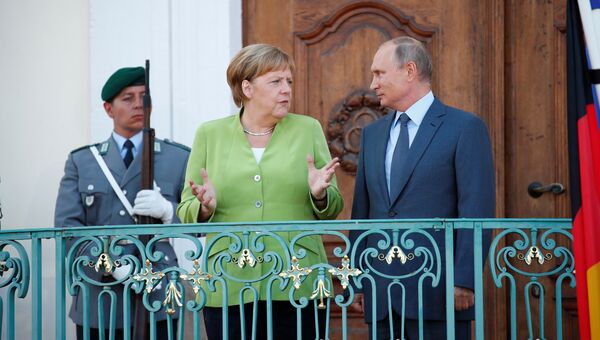 Президент России Владимир Путин и канцлер Германии Ангела Меркель во время встречи в Гранзе, Германия. 18 августа 2018