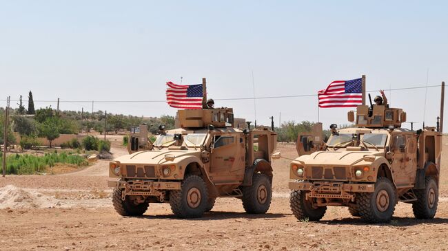 Американские военнослужащие в районе населенного пункта Манбидж, Сирия. 28 июля 2018