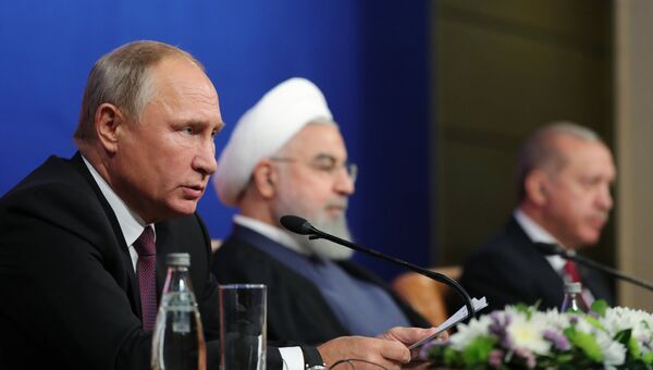 Владимир Путин, президент Ирана Хасан Рухани и президент Турции Реджеп Тайип Эрдоган на пресс-конференции по итогам трехсторонней встречи в Тегеране. 7 сентября 2018