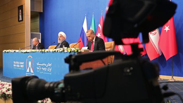 Владимир Путин, президент Ирана Хасан Рухани и президент Турции Реджеп Тайип Эрдоган на пресс-конференции по итогам трехсторонней встречи в Тегеране. 7 сентября 2018