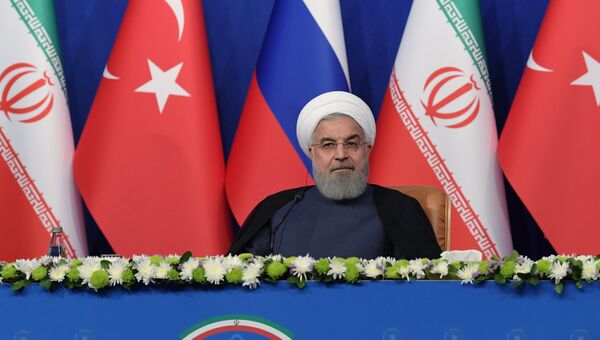 Президент Ирана Хасан Рухани на пресс-конференции по итогам трехсторонней встречи с президентом РФ Владимиром Путиным и президентом Турции Реджепом Тайипом Эрдоганом в Тегеране. 7 сентября 2018