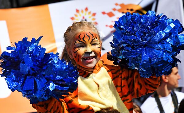 Юная участница праздничных мероприятий, посвященных Дню тигра, во Владивостоке