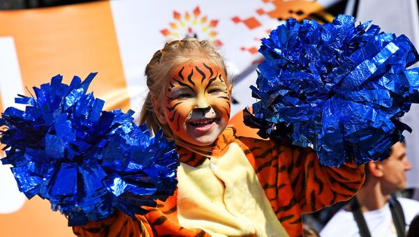 Юная участница праздничных мероприятий, посвященных Дню тигра, во Владивостоке