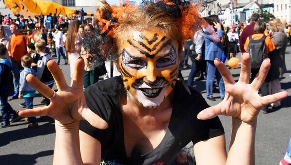 Участница праздничных мероприятий, посвященных Дню тигра, во Владивостоке