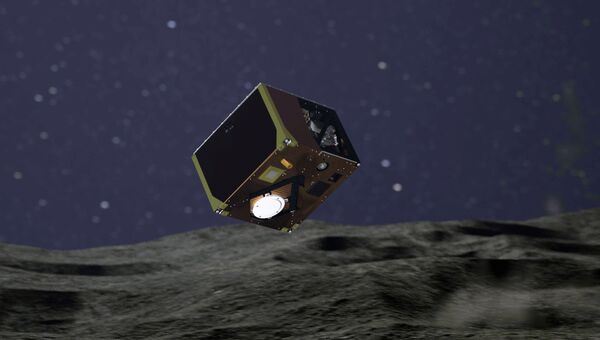 Так художник представил себе ровер MASCOT, опускающийся на поверхность астероида