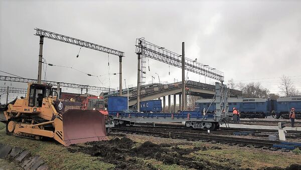Аварийно-восстановительные работы на месте обрушенного моста в городе Свободном Амурской области. Архивное фото