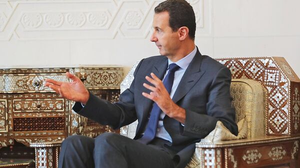 Президент Сирийской арабской республики Башар Асад во время встречи с главой Республики Крым Сергеем Аксёновым в Дамаске. 16 октября 2018
