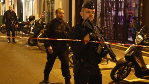 Французская полиция на месте нападения с ножом в центре Парижа. 12 мая 2018