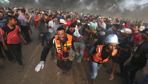 Столкновения палестинцев с израильскими военными на границе с сектором Газа