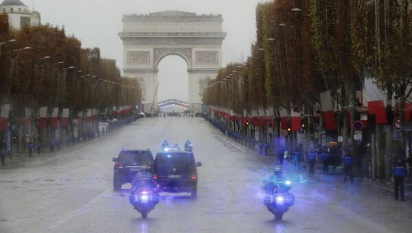 У Триумфальной арки в Париже перед началом мемориального мероприятия по случаю 100-летия окончания Первой мировой войны. 11 ноября 2018