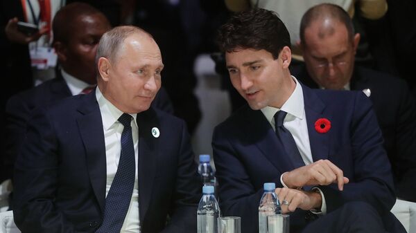 Президент РФ Владимир Путин и премьер-министр Канады Джастин Трюдо на Парижском форуме мира. 11 ноября 2018