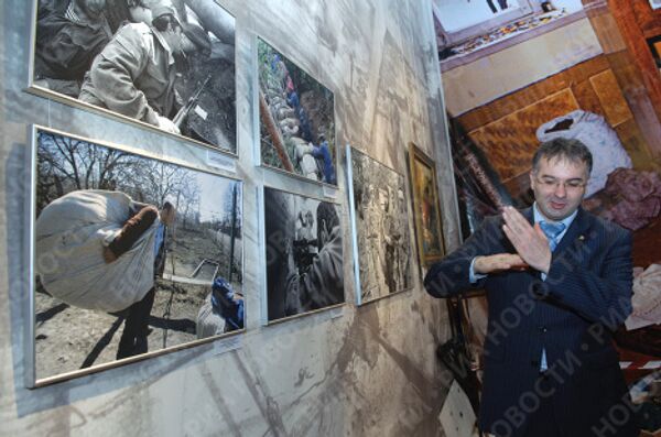 Фотовыставка РИА Новости о войне в Южной Осетии открывается в Москве