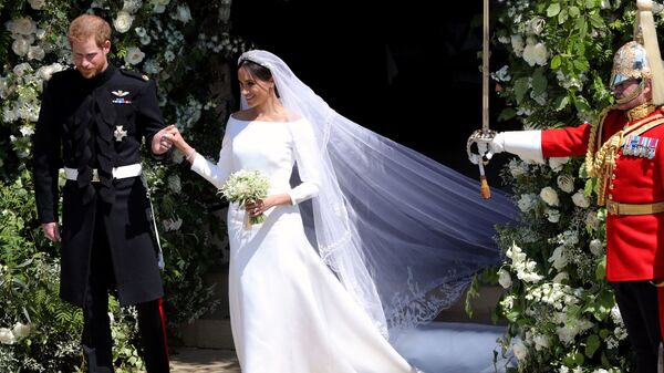 Британский принц Гарри и его жена Меган после свадебной церемонии в Виндзоре
