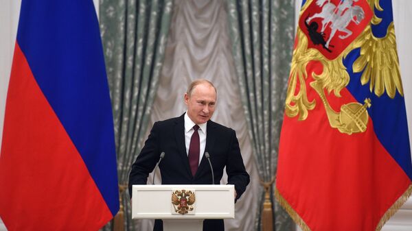 Владимир Путин выступает на церемонии вручения Государственных премий за выдающиеся достижения в правозащитной и благотворительной деятельности. 12 декабря 2018