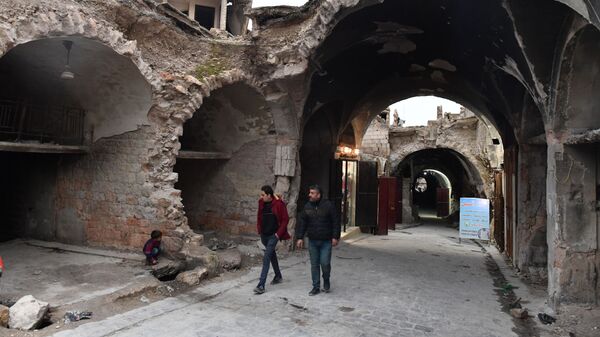 Разрушенный район в Алеппо