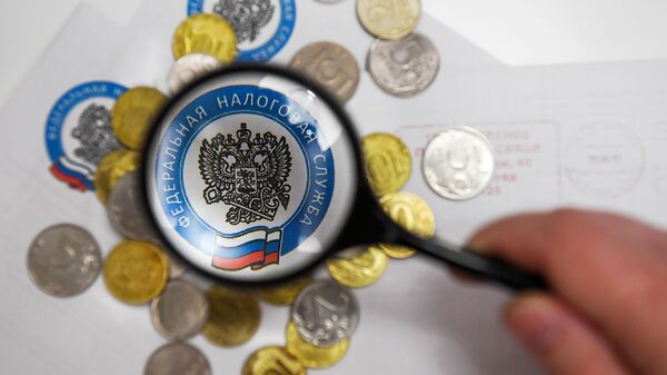 Монеты России и конверты с логотипом ФНС РФ