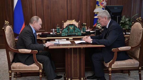 Владимир Путин и директор Росфинмониторинга Юрий Чиханчин во время встречи. 11 марта 2019