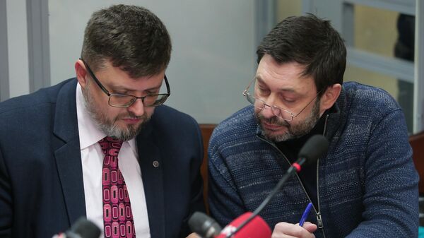 Руководитель портала РИА Новости Украина Кирилл Вышинский и адвокат Андрей Доманский