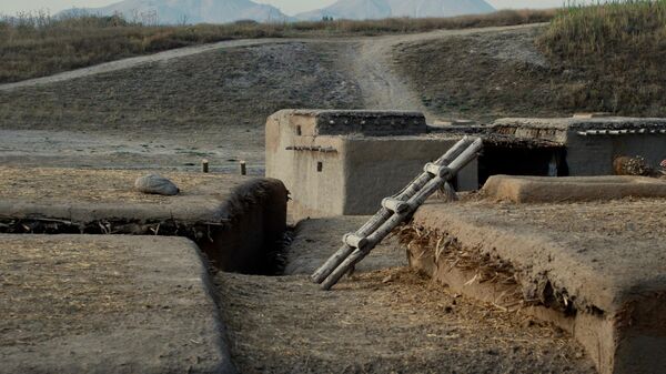Реконструкция древних домов, чьи фундаменты были найдены в Ашыклы Хеюке