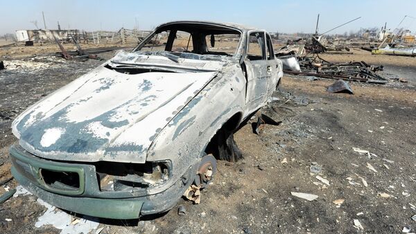 Сгоревший в результате пожара автомобиль в селе Усть-Ималка Ононского района Забайкальского края