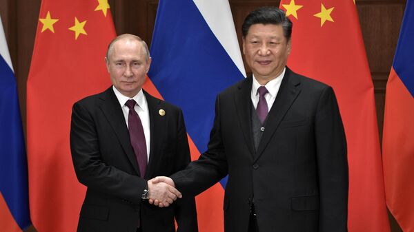 Президент РФ Владимир Путин и председатель Китайской народной республики Си Цзиньпин во время встречи в Пекине. 25 апреля 2019