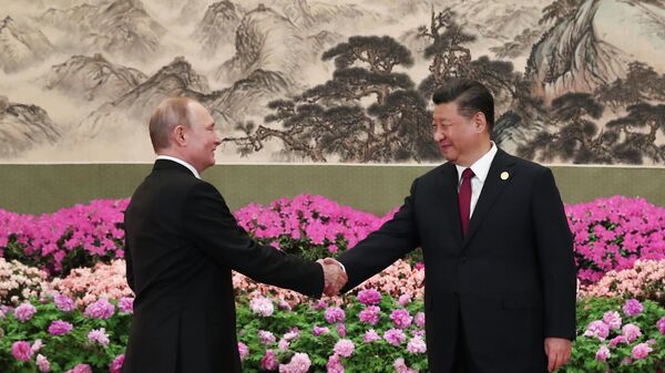 Президент РФ Владимир Путин и председатель Китайской народной республики Си Цзиньпин на форуме международного сотрудничества Один пояс - один путь в Пекине. 2019 год 