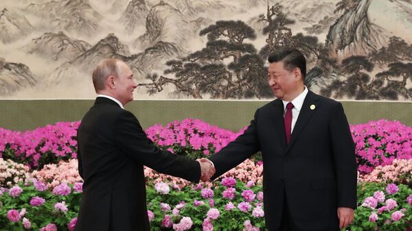 Президент РФ Владимир Путин и председатель Китайской народной республики Си Цзиньпин на форуме международного сотрудничества Один пояс - один путь в Пекине. 2019 год 