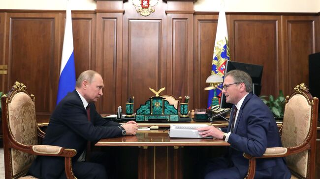 Владимир Путин и уполномоченный при президенте РФ по защите прав предпринимателей Борис Титов во время встречи. 27 мая 2019