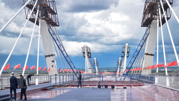 Стыковка международного трансграничного автомобильного моста через реку Амур в районе российского города Благовещенска и китайского города Хэйхэ. 31 мая 2019