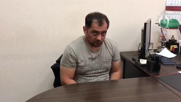 Кадры с задержанным по делу об убийстве экс-спецназовца в Подмосковье