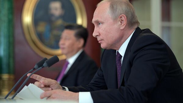  Президент РФ Владимир Путин на пресс-конференции по итогам переговоров с председателем Китайской Народной Республики Си Цзиньпинем. 5 июня 2019