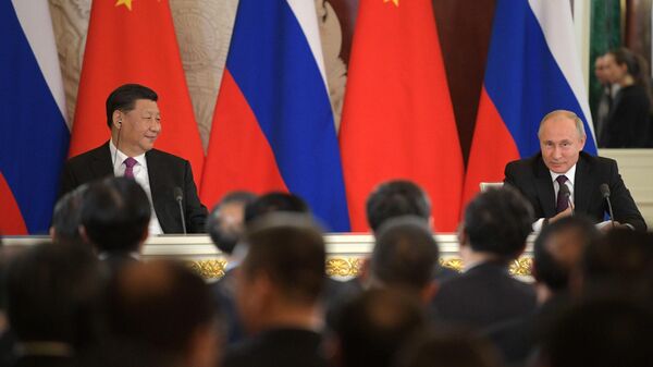  Президент РФ Владимир Путин и председатель КНР Си Цзиньпин на пресс-конференции по итогам российско-китайских переговоров в Кремле. 5 июня 2019