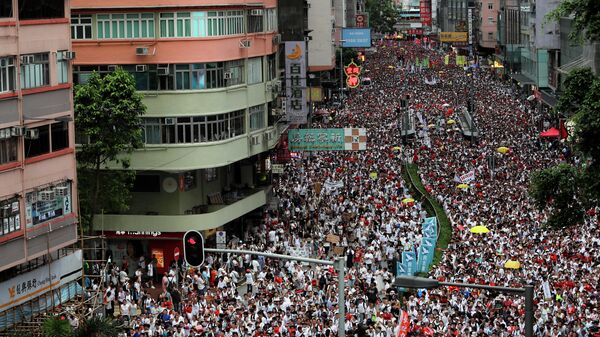 Демонстрация в Гонконг в знак протеста против поправки к законопроекту об экстрадиции. 9 июня 2019
