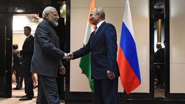Владимир Путин и премьер-министр Индии Нарендра Моди во время встречи. 13 июня 2019