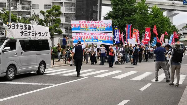 Акция протеста против открывшегося в пятницу саммита лидеров стран двадцатки G20 в Японской Осаке