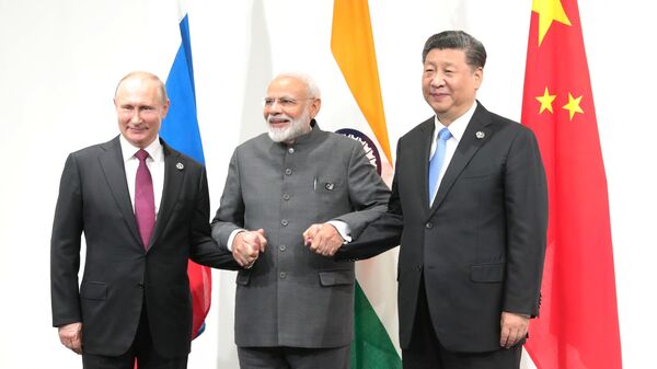Президент РФ Владимир Путин, премьер-министр Индии Нарендра Моди и председатель КНР Си Цзиньпин на саммите Группы двадцати. 28 июня 2019