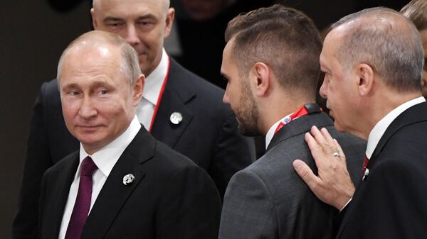 Президент РФ Владимир Путин и президент Турции Реджеп Тайип Эрдоган (справа) на полях саммита Группы двадцати. 28 июня 2019