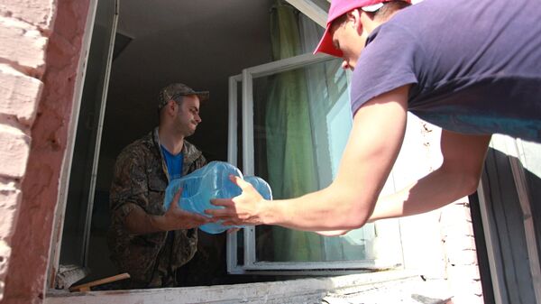 Пострадавшие от наводнения получили питьевую воду с форума Байкал