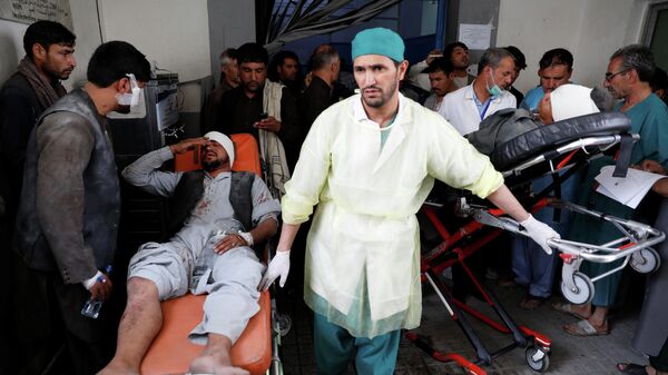 Раненый мужчина после взрыва в Кабуле, Афганистан. 7 августа 2019 