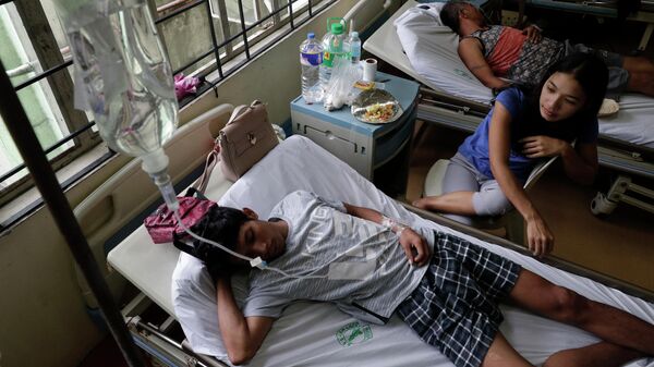 Пациенты с лихорадкой денге в больнице Сан-Лазаро в Маниле, Филиппины