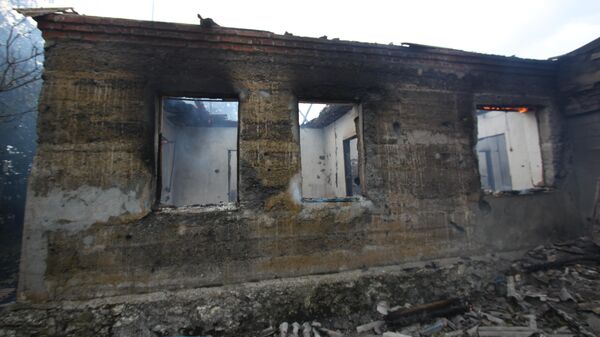 Здание, подвергшееся пожару вследствие обстрела 6 сентября, в селе Роза Новоазовского района Донецкой области