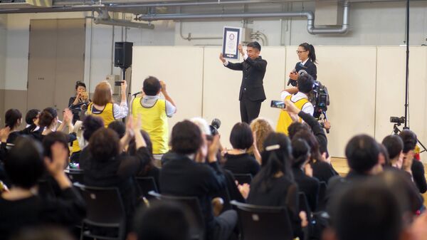 Выступление 289 человек в Японии с инструментом в виде матрешки вошло в книгу Гиннеса