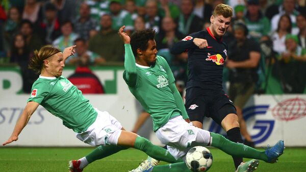 (L-R) Bremen's Swiss defender Michael Lang, Bremen's Czech defender Theodor Gebre Selassie and Leipzig's German forward Timo Werner vie for the ball during the German first division Bundesliga football match between Werder Bremen and RB Leipzig in Bremen, northwestern Germany, on September 21, 2019. (Photo by PATRIK STOLLARZ / AFP) / DFL REGULATIONS PROHIBIT ANY USE OF PHOTOGRAPHS AS IMAGE SEQUENCES AND/OR QUASI-VIDEO