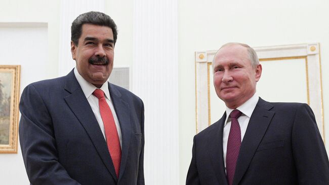 Президент РФ Владимир Путин и президент Венесуэлы Николас Мадуро во время встречи