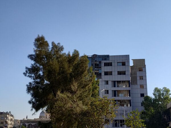 Поврежденное в результате обстрела здание в районе Барза. Дамаск Поврежденное в результате обстрела здание в районе Барза. Дамаск