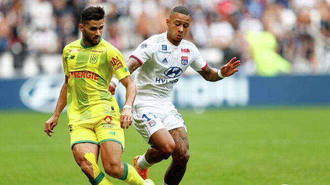 Soccer Football - Ligue 1 - Olympique Lyonnais v Nantes - Groupama Stadium, Lyon, France - September 28, 2019  Olympique Lyonnais' Memphis Depay in action with Olympique Lyonnais' Memphis Depay                REUTERS/Emmanuel Foudrot