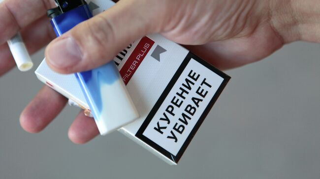 Предупреждение на пачке сигарет. Архивное фото