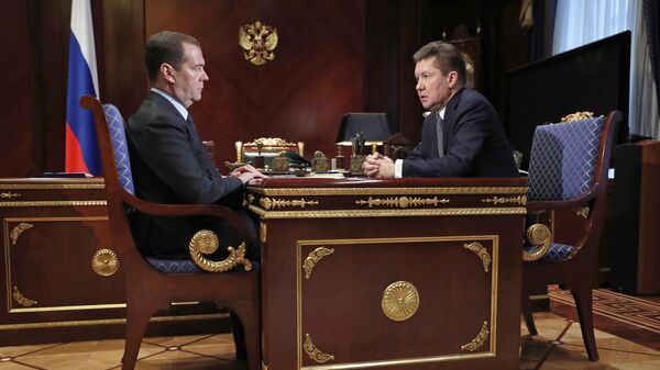 Председатель правительства России Дмитрий Медведев и председатель правления компании Газпром Алексей Миллер во время встречи